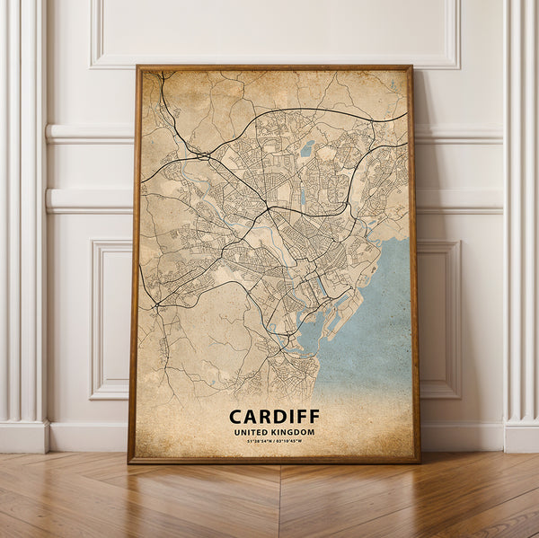 a framed map of cardiff, england on a wooden floor