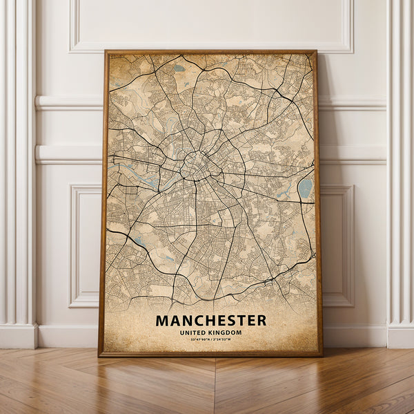 a framed map of manchester, england on a wooden floor